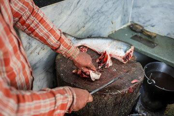 fresh fish cutting at retail shop for sale at day from different angle