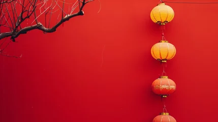 Tuinposter a row of lanterns on a red wall © Alexei