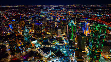 Approaching the building of Bank of America tower with beautiful green neon illumination. Stunning city panorama at night from top. © Vadim