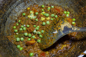 mixed spices cooking at cauldron at home at day