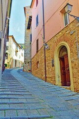 Fototapeta na wymiar characteristic alley in the medieval village of Massa Marittima in Grosseto, Tuscany, Italy