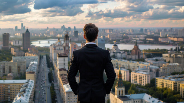 A businessman overlooking the city from his office