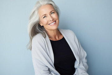 Beautiful mature woman with long grey hair smiling. Active lifestyle positive mindset fashion concept