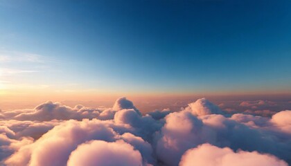 Fototapeta premium Beautiful aerial view above clouds at sunset. Cloudscape with blue sky.