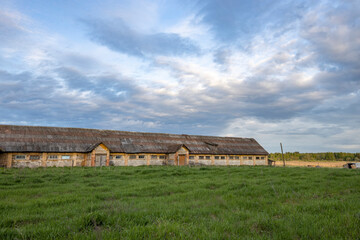 Fototapeta na wymiar Rural landscape with an old, abandoned farm building