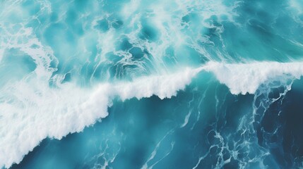 Aerial view of a turquoise ocean wave cresting with white foam against deep blue water - obrazy, fototapety, plakaty