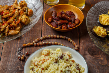Shabbat table for a family dinner with traditional holiday dishes and drinks. Horizontal photo.