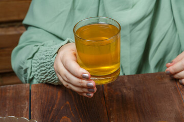 A Muslim woman begins a meal at the end of the fast, Ramadan Iftar