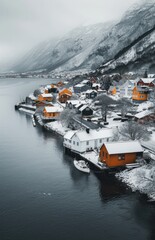 a body of water with a bunch of houses on it in the middle of a snow covered area with a mountain in the background.