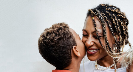 Mother and child son having tender moment together. African American family and love concept - obrazy, fototapety, plakaty