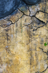 Weathered, Yellow Concrete Wall: Captivating Texture in Detailed Shot!