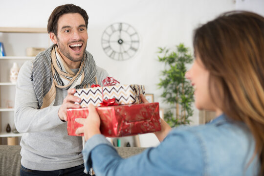 boyfriend receiving gifts from his partner