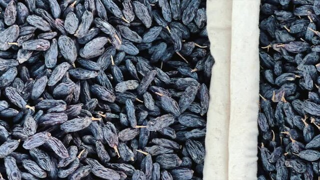Dried Fruits, nuts and Spices market in Samarkand, Uzbekistan - June 29, 2023: Goods and traders at the Oriental Bazaar in Uzbekistan. Siab Bazaar is the largest and oldest bazaar in Samarkand. 4K