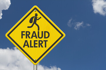 Fraud Alert message on warning road sign