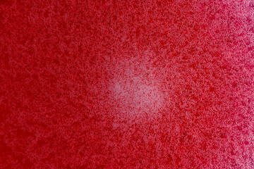 Bubbles on the surface of the drink of red raspberries soda drink on background. Fresh drink of...