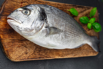 raw fish sea bream seafood fresh cooking snack appetizer meal food on the table copy space food background rustic top view