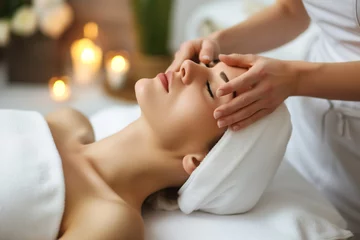 Papier Peint photo Spa Relaxed young woman getting facial massage in spa salon. Beauty treatment concept