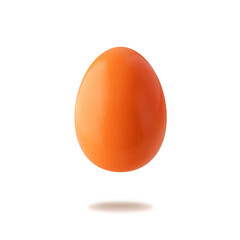 Painted in orange color natural easter chicken egg flying isolated on white background. One orange festive egg closeup