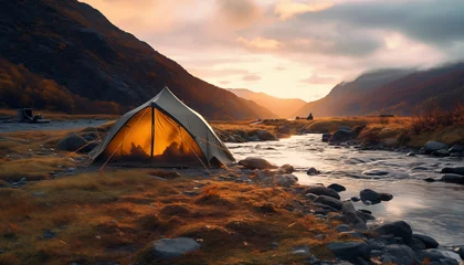 Foto op Aluminium tent against the backdrop of dawn in the mountains near a river with a blurred background © Juli Puli