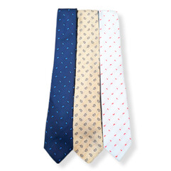 Blue, beige and white patterned ties isolated on white background