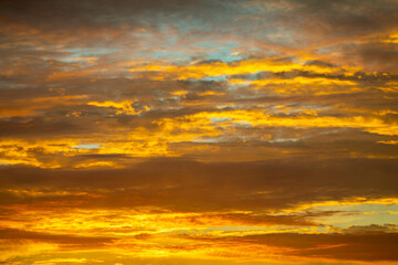 Beautiful idyllic sky at dawn with strong yellow and orange colors