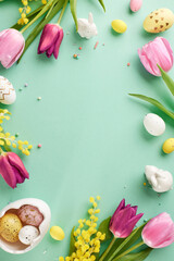 Easter awakening: festive spirit in every detail. Top view vertical shot of pink tulips, patterned...