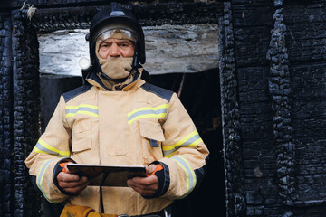 Fireman inspector conducts investigation to determine circumstances of fire in house and uses...