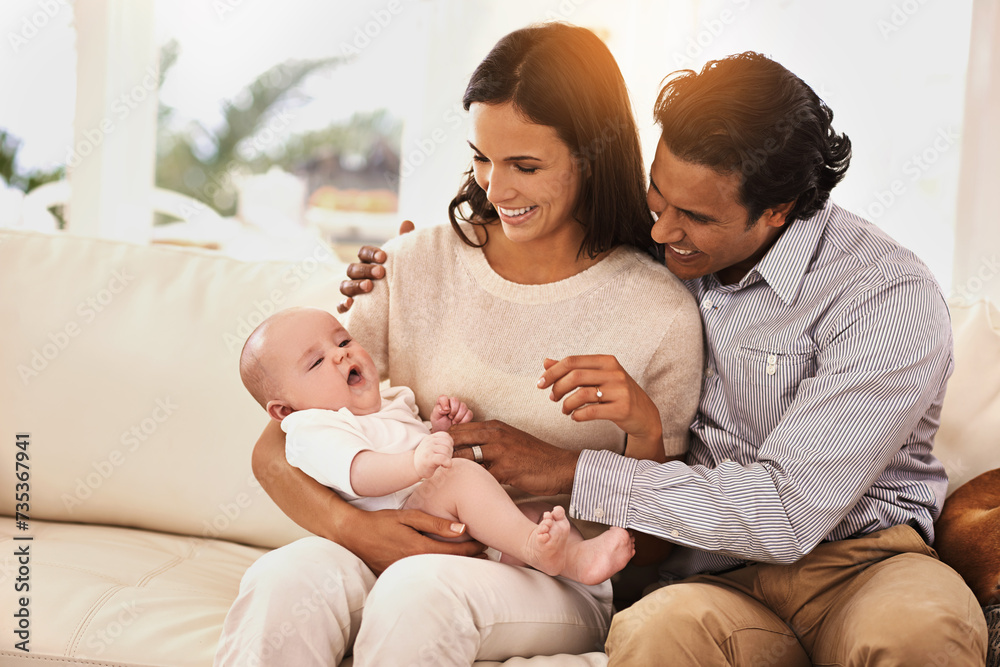 Poster Happy family, baby and hug on sofa for bonding, support or love together in relax at home. Father and mother holding little child, kid or newborn toddler on living room couch with smile at house