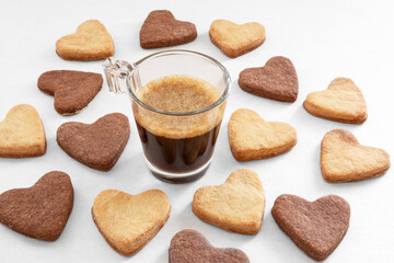 Cup of coffee and heart-shaped cookies for Valentine's Day