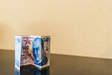 Close up Shot of 100 One Hundred Turkish Lira Bill on a Table Surface, Turkish Economy and Finance,...