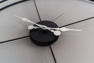 Close Up Angled Shot of a Wall Clock Showing the Hours, minutes and seconds handles. Interior home...