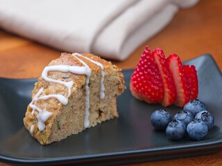 Zucchini bread slice and fruit.