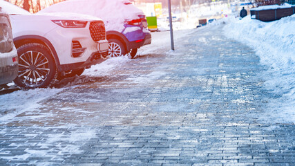 Cars parked along sidewalk in winter, Cars parked in a row on outdoor parking. Rows of different...