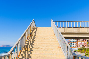 Upwards Shot of a Stairway Staircase Leading Up to the Clear Blue Sky, Pedestrian Bridge in the Sunny Summer