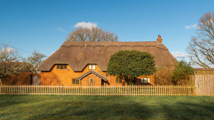 A traditional thatched cottage in rural England.