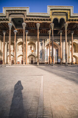 Obraz premium Exterior of the Bolo-Hauz Mosque in the ancient city of Bukhara in Uzbekistan, oriental architecture at dawn in the morning Bolohovuz masjidi