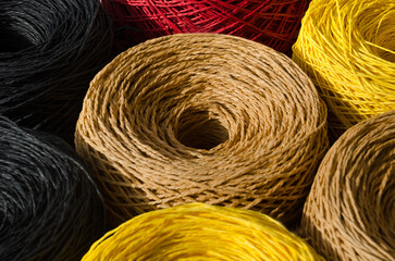 Skeins of multi-colored raffia are ready for knitting. Eco material for handmade work.