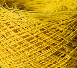 Raffia close-up.A skein of yellow raffia is ready for knitting. Eco-friendly handmade material.