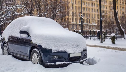 Fotobehang car covered with snow moscow russia © Pauline