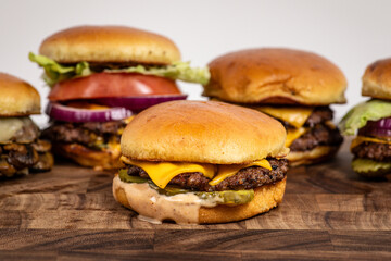 Single cheeseburger with other burgers