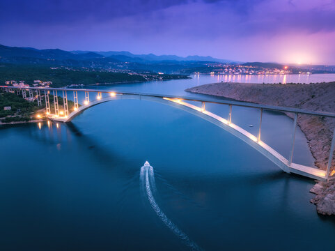 Bridge over the sea at sunset. Aerial view of modern Krk bridge