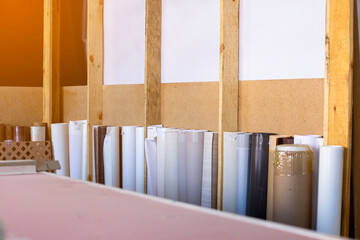 rolls of film for MDF panels lying in the furniture workshop ready for stickers on products