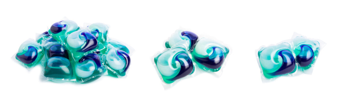 Capsules for washing laundry detergents for washing clothes in a washing machine isolated on a white background. The concept of purity. Place for text.
