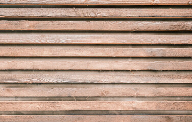 Decorative wood panels on wall in modern exterior. Detail in minimalist design at house and decoration from natural wooden materials