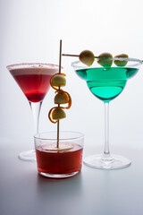 group of colorful cocktails on white background