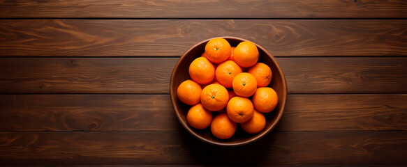 Fresh juicy clementine tangerines on a wooden table, view with copy space.