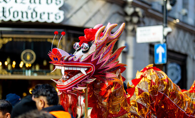 Naklejka premium Dragon dance during Chinese lunar year celebrations in London, England