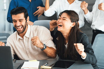 Excited and happy office worker employee celebrate after make successful strategic business...