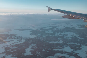 Snowy winter landscape in Finnish Lapland view from an airplane window