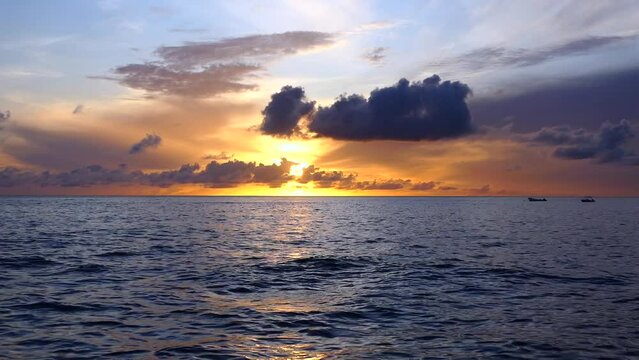 Paynes Bay Beach, Barbados: an amazing colorful sunset in the caribbean sea.